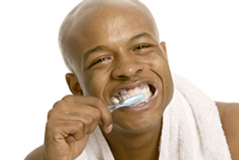 a man brushing his teeth