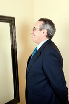 a man looking in the mirror