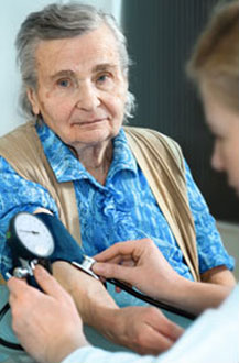 older woman getting her blood pressure checked