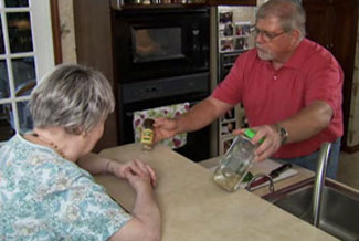 a man feeding his mom