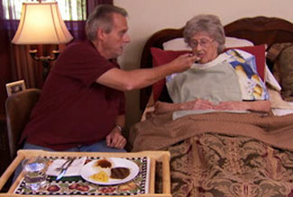 woman being fed in bed