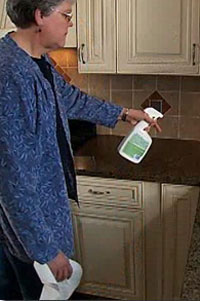 woman cleaning counter tops