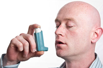 Person using an inhaler