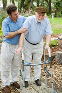 a man helping another with a walker