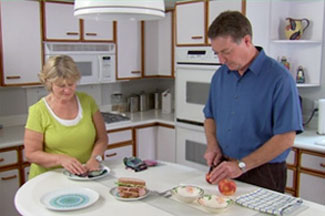 man and woman preparing meal